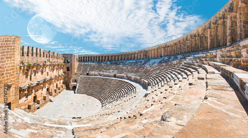 Roman amphitheater of Aspendos with full moon, Belkiz, Antalya, Turkey.