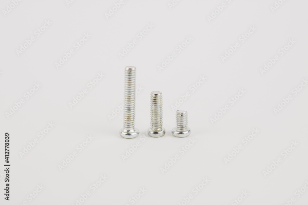 many new bolts for repair on a white background many new bolts for repair on a white background