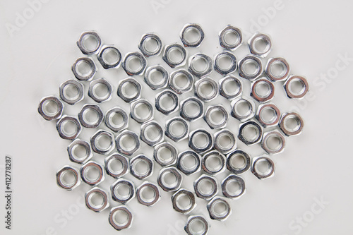 many new nuts for repair on a white background
