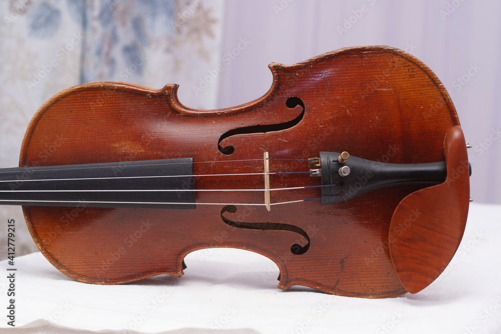 Antique fine violin on a table different sides
Antique fine violin on a table different sides