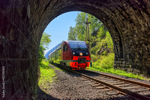 Commuter train pulls into tunnel