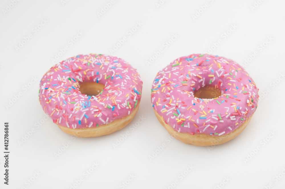 Two pink donuts on a white background Two pink donuts on a white background