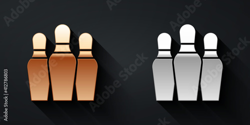 Gold and silver Bowling pin icon isolated on black background. Long shadow style. Vector.