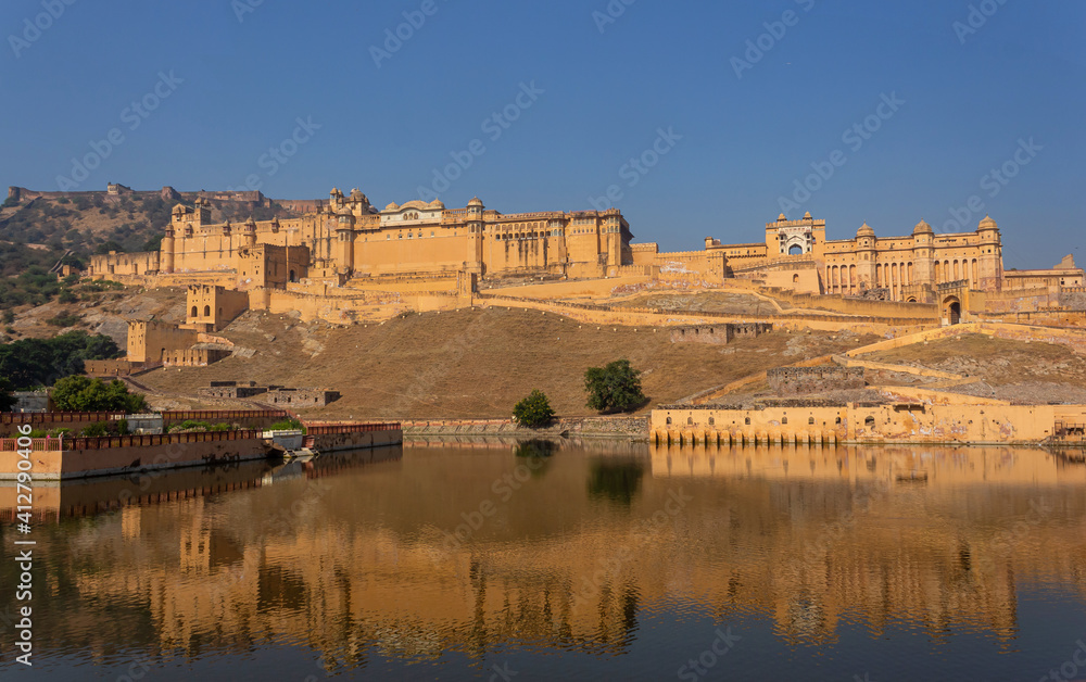 View and reflection of Amber Fort and Palace build by Rajput King Sawai Mansingh in 1592, Jaipur, Rajasthan, India.