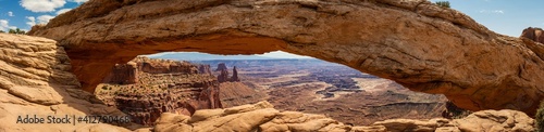 Close up of Mesa arch and look through to canyons at sunny day in canyonlands in utah, america