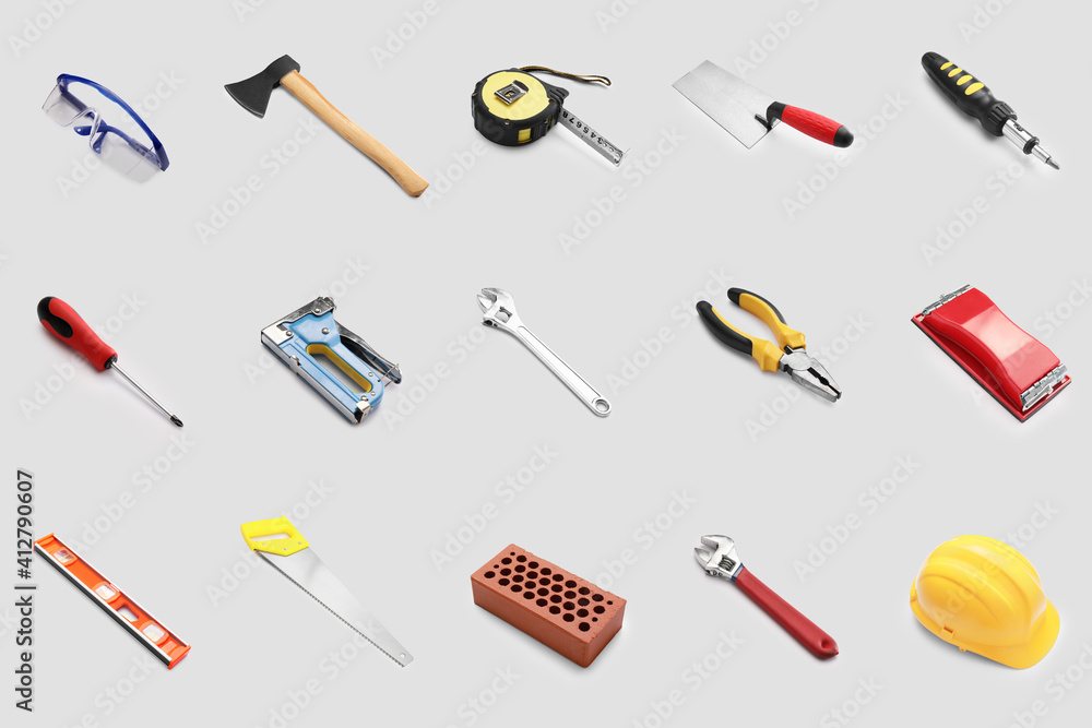 Set of construction tools on grey background Set of construction tools on grey background