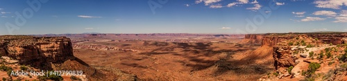 Panorama shot of sandy red canyons in island in the sky at sunny day of part canyonland national park in Utah, america