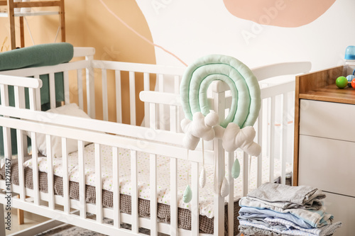 Empty white wooden baby cri...