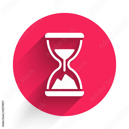 White Old hourglass with flowing sand icon isolated with long shadow. Sand clock sign. Business and time management concept. Red circle button. Vector.