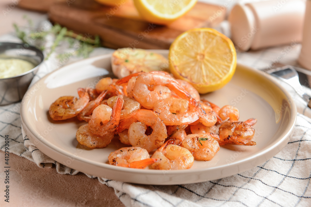 Plate with tasty shrimps on table, closeup Plate with tasty shrimps on table, closeup