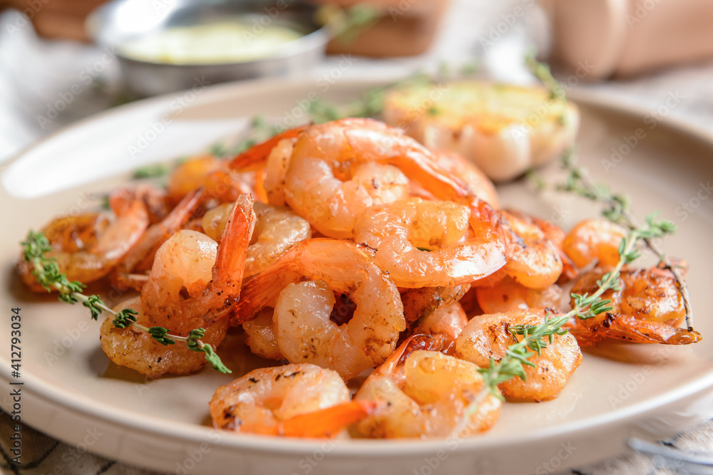 Plate with tasty shrimps on table, closeup Plate with tasty shrimps on table, closeup