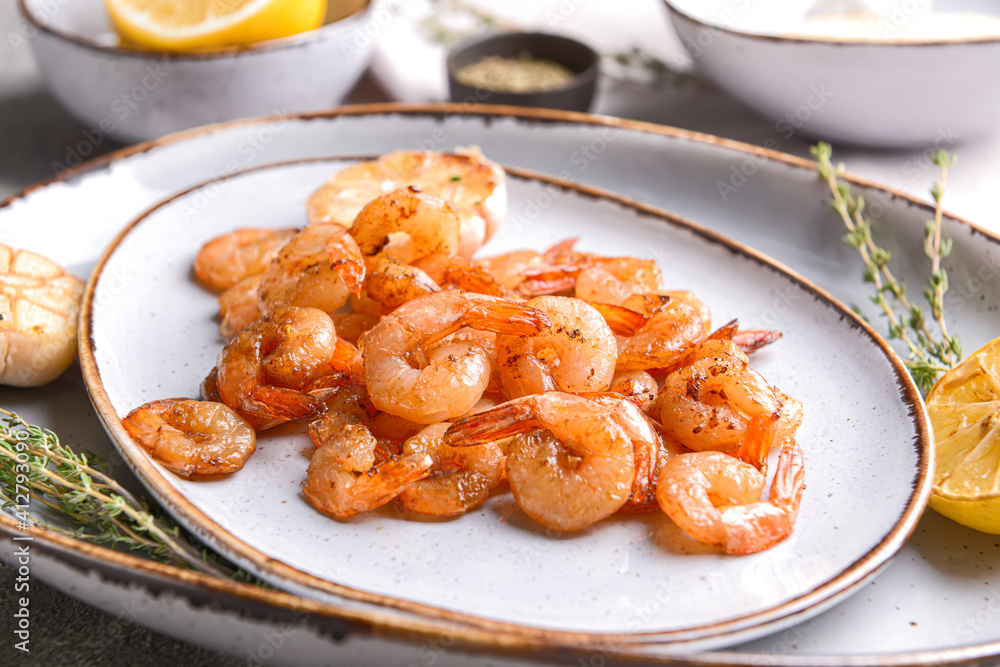 Plate with tasty shrimps on table, closeup Plate with tasty shrimps on table, closeup