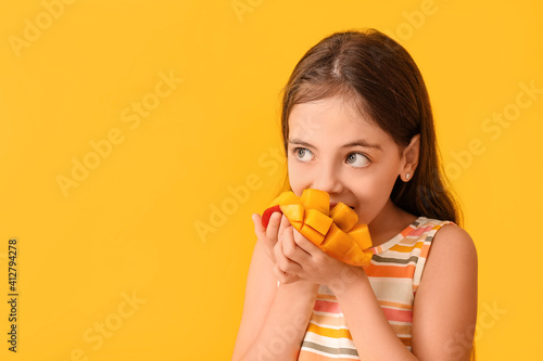 Cute little girl eating tas...