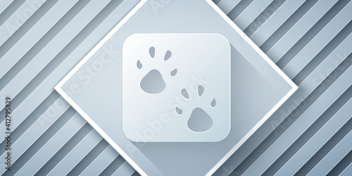 Paper cut Paw print icon isolated on grey background. Dog or cat paw print. Animal track. Paper art style. Vector.
