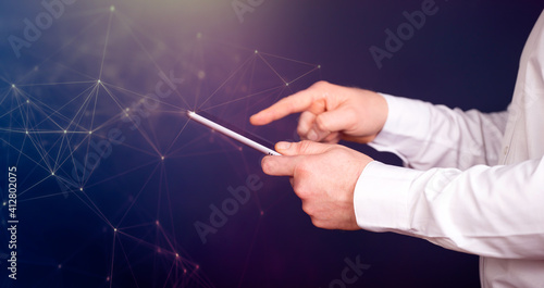 Businessman using tablet, double exposure with network