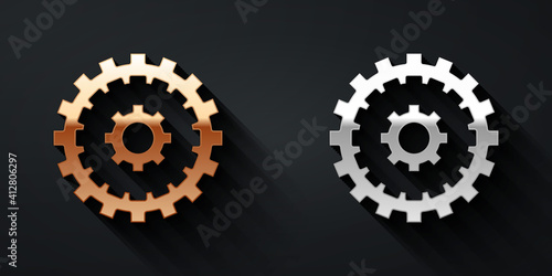 Gold and silver Bicycle cassette mountain bike icon isolated on black background. Rear Bicycle Sprocket. Chainring crankset with chain. Long shadow style. Vector.