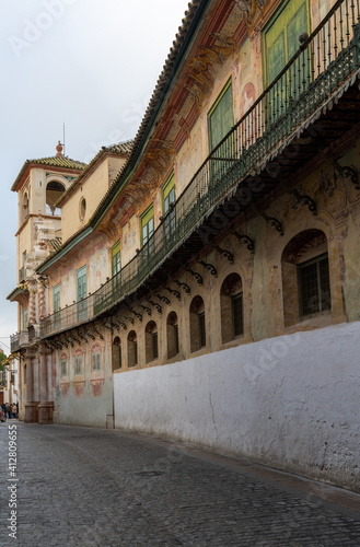 narrow city street in the historic city center of Ecija with the Marquis of Penaflor Palace