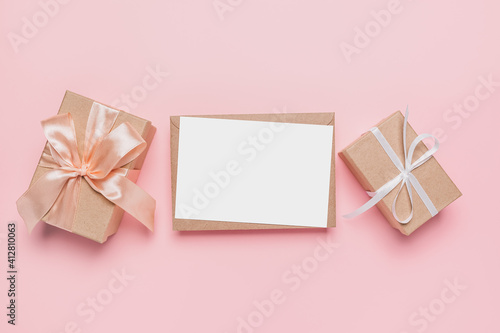 Gifts with note letter on isolated pink background, love and valentine concept