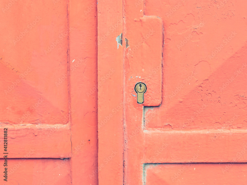 Old door lock, aged red door. Home security. Vintage lock Old door lock, aged red door. Home security. Vintage lock