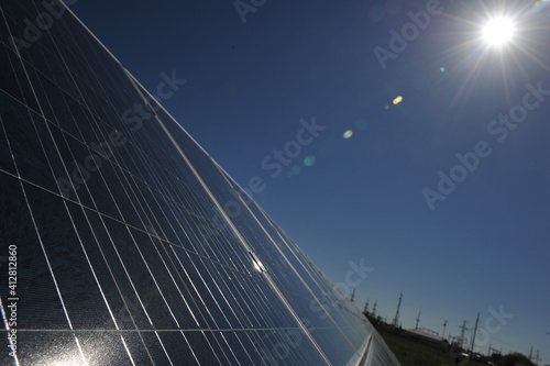 Zhambyl region, Kazakhstan - 05.15.2013 : The glare of sunlight falls on the blue plates of the station's panels photo