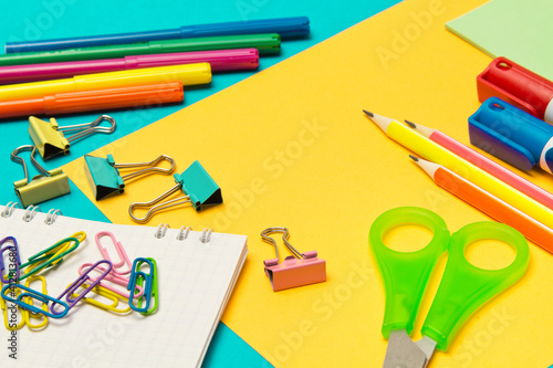 Stationery. School and office supplies on a colored background. Selective focus