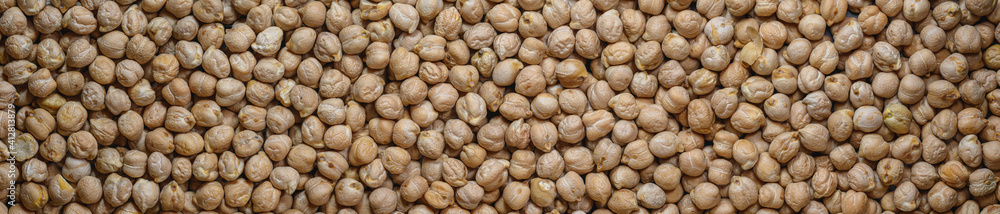 Close-up chickpeas, dry beans. chickpeas seeds abstract panoramic background. Close-up chickpeas, dry beans. chickpeas seeds abstract panoramic background.
