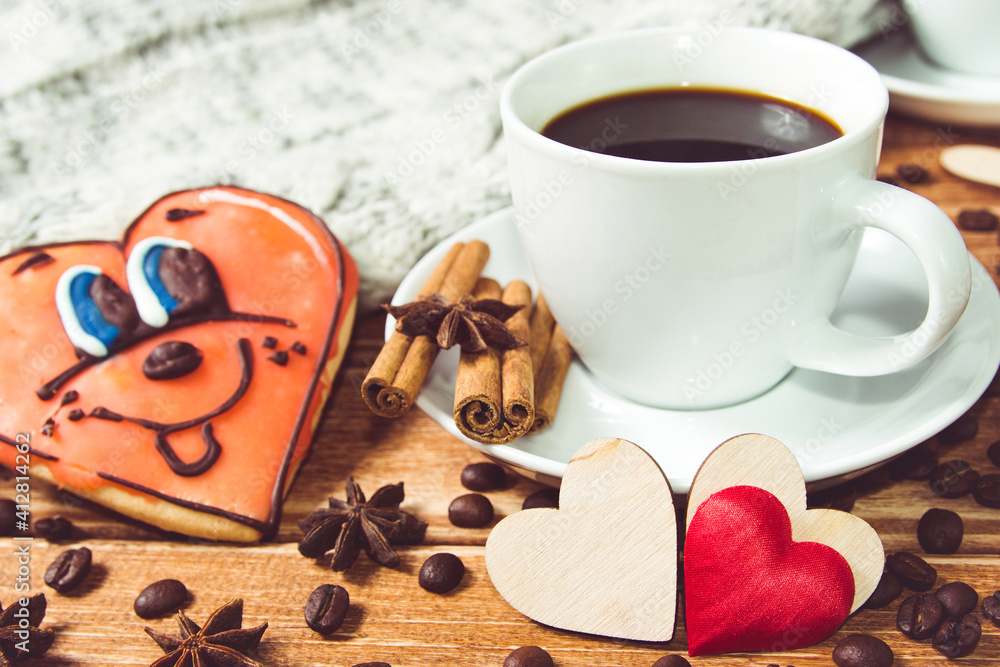 Valentine's day concept . Cup of coffee and two heart on wooden background with food decor. Valentine's day concept . Cup of coffee and two heart on wooden background with food decor.
