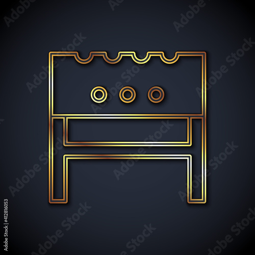 Gold line BBQ brazier icon isolated on black background. Vector.