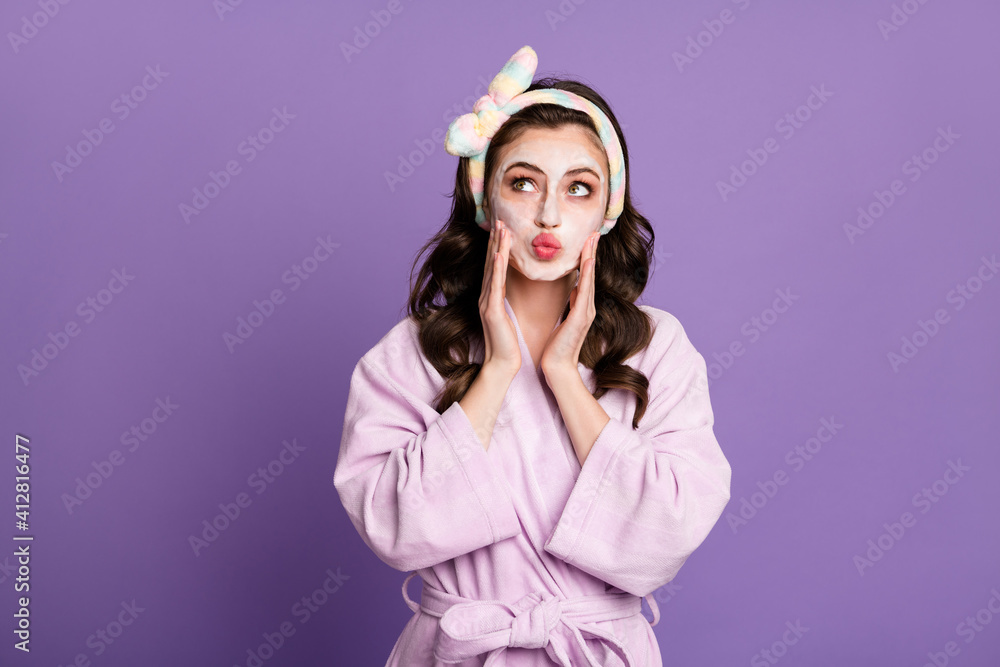 Photo portrait of dreamy girl cleaning skin with foam looking at blank space sending air kiss isolated on vivid violet color background Photo portrait of dreamy girl cleaning skin with foam looking at blank space sending air kiss isolated on vivid violet color background