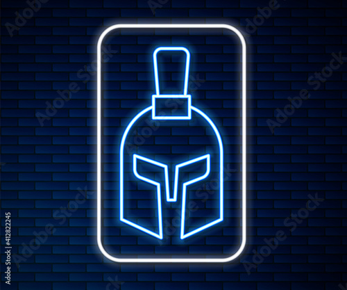 Glowing neon line Greek helmet icon isolated on brick wall background. Antiques helmet for head protection soldiers with a crest of feathers or horsehair. Vector.