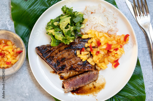 Seared tuna steak with pineapple salsa, rice and avocado