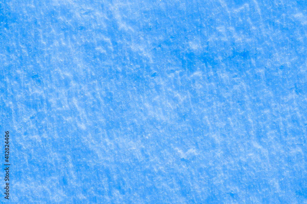 blue texture of an ice surface covered with snow ,cold clear cryslallized wall background ,winter frozen surface close up , abstract macro wallpaper blue texture of an ice surface covered with snow ,cold clear cryslallized wall background ,winter frozen surface close up , abstract macro wallpaper
