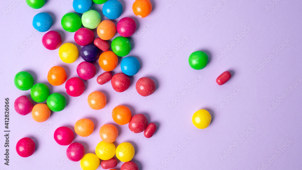 Obraz premium colorful little candies on a colored background