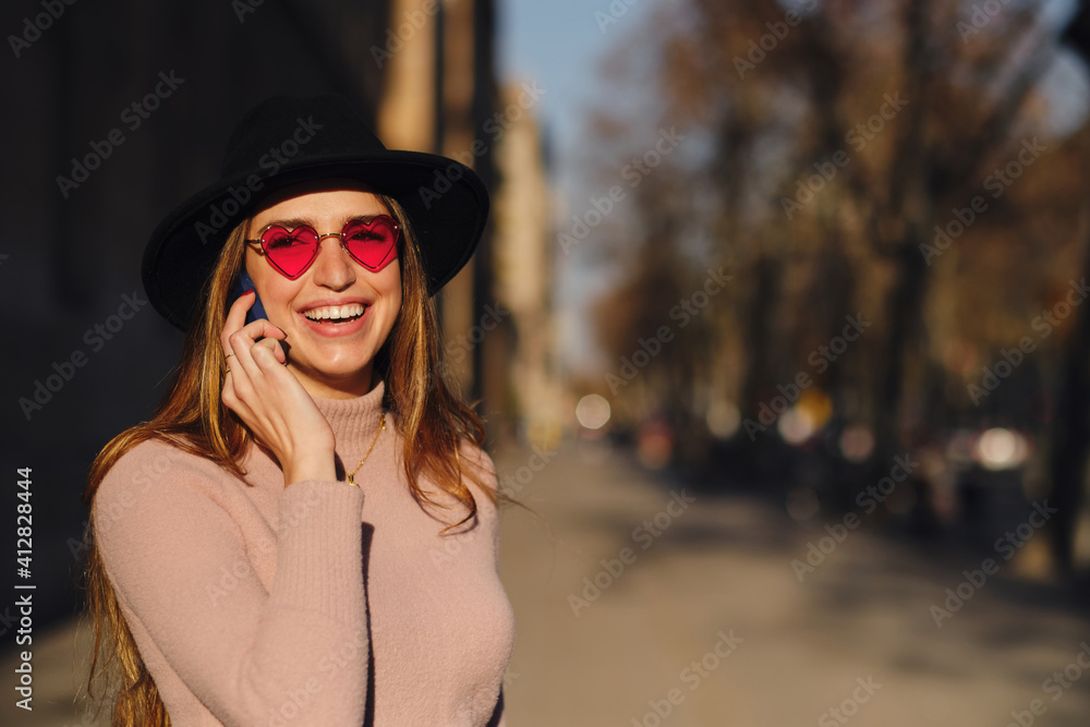Woman talking on the phone outdoors. Woman talking on the phone outdoors.