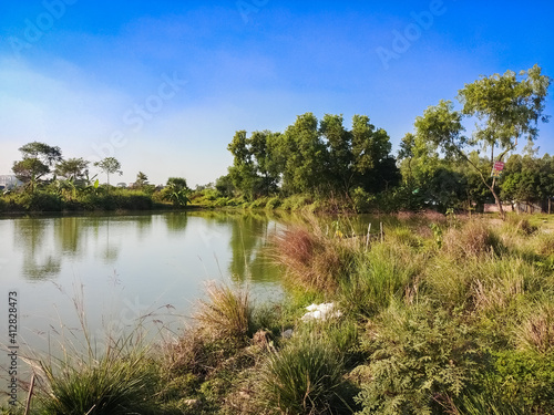 natural bright sunny day landscape water reflection