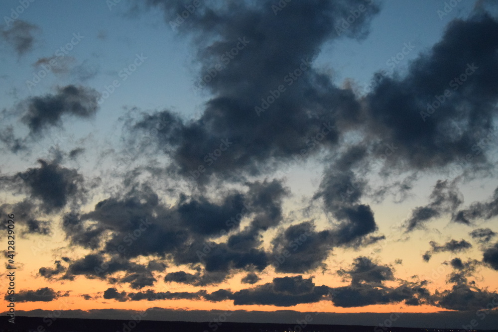 The sky at sunset. Evening. Clouds. The sky at sunset. Evening. Clouds.
