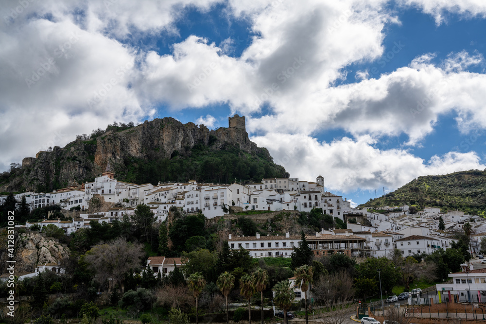 view of the whitwashed Andalusian village of Zahara de la Sierra and its Moorish Castle on the hilltop