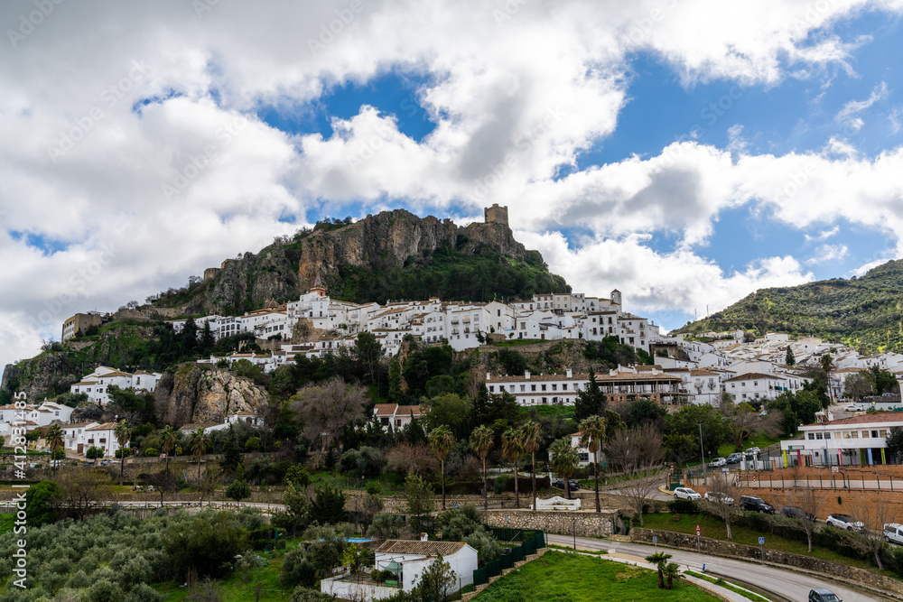 view of the whitwashed Andalusian village of Zahara de la Sierra and its Moorish Castle on the hilltop