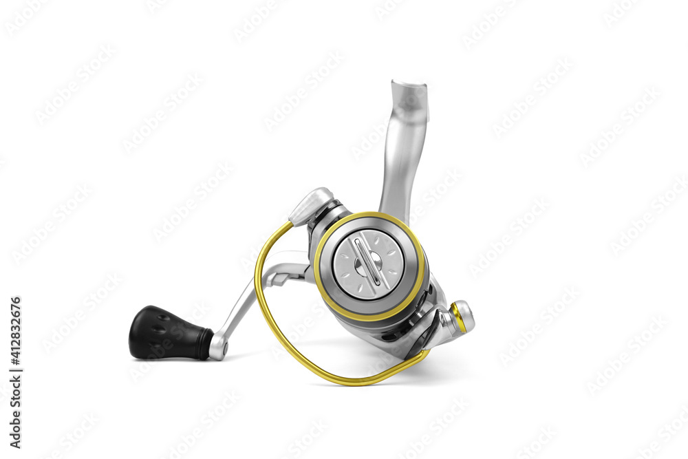 Fishing reel isolated on white background. Fishing supplies and equipment. Fishing reel isolated on white background. Fishing supplies and equipment.