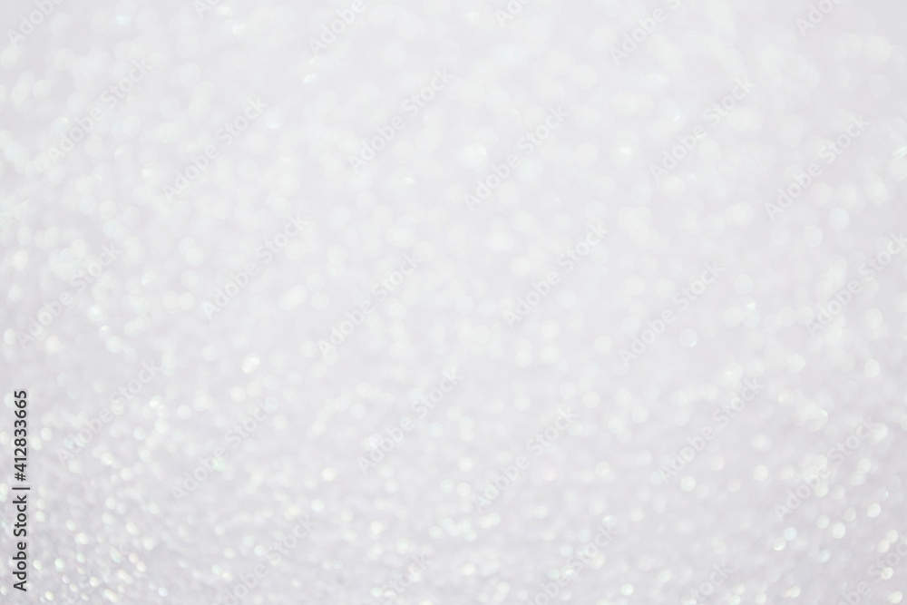 Glitter bokeh shiny background white