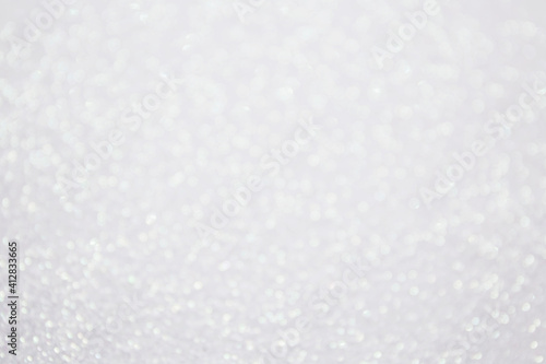Glitter bokeh shiny background white