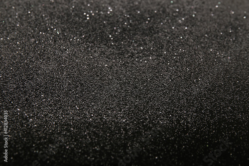 silver glitter on a black background