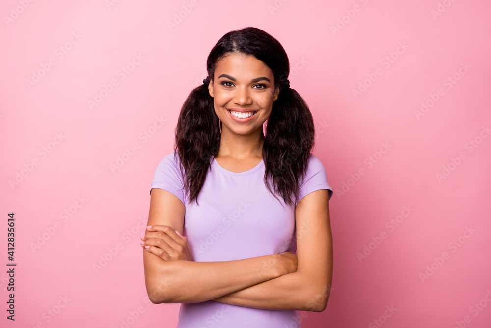 Photo of afro american confident happy woman crossed hands good mood isolated on pastel pink color background Photo of afro american confident happy woman crossed hands good mood isolated on pastel pink color background