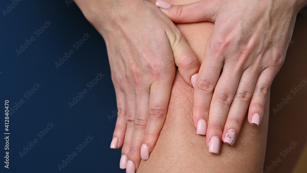Woman doing foot massage with hands, close-up Woman doing foot massage with hands, close-up