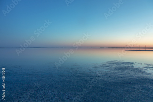 amazing calm blue lake at sunset. natural abstract background