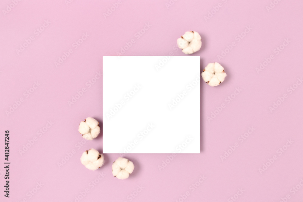 Square paper card mockup with frame made of cotton on a purple pastel background. Eco concept.
