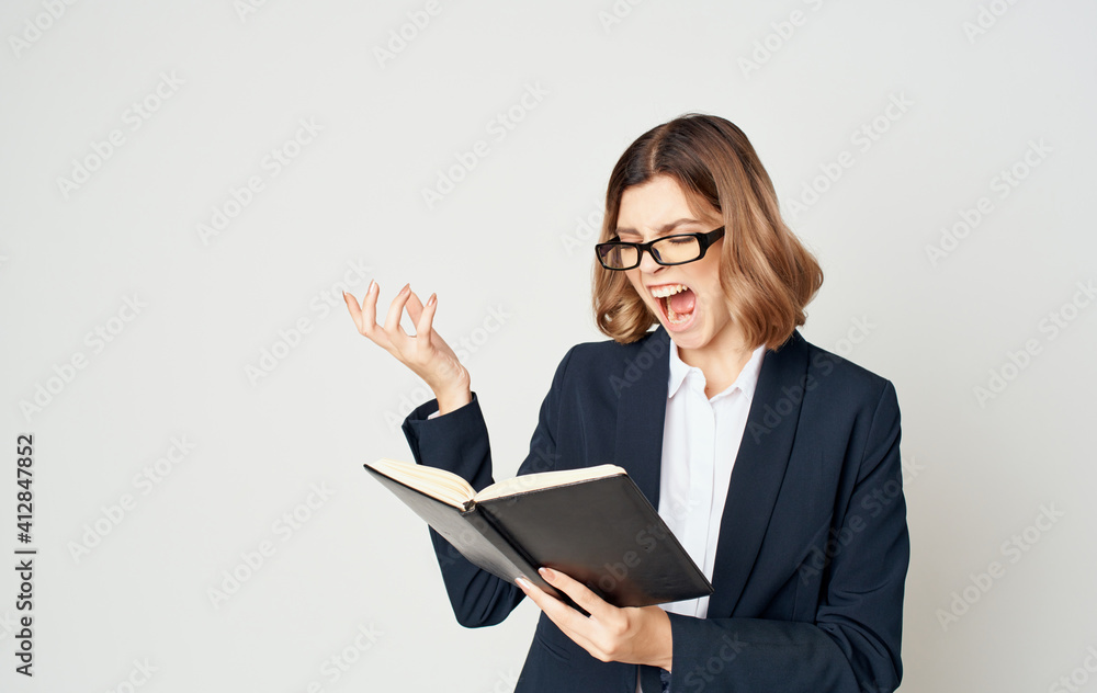 Business woman with documents on a light background portrait suit finance Business woman with documents on a light background portrait suit finance