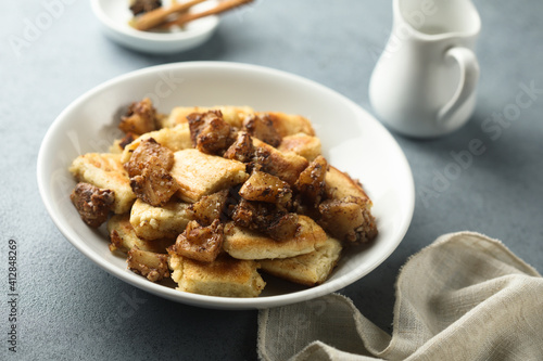 Photography Traditional Austrian pancake dessert with apple and raisins
