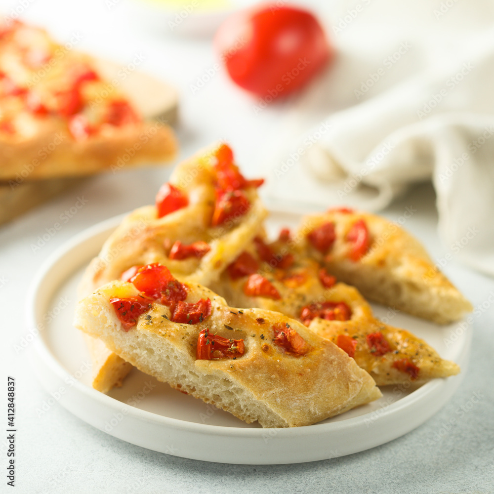 Delicious homemade focaccia bread with tomatoes Delicious homemade focaccia bread with tomatoes