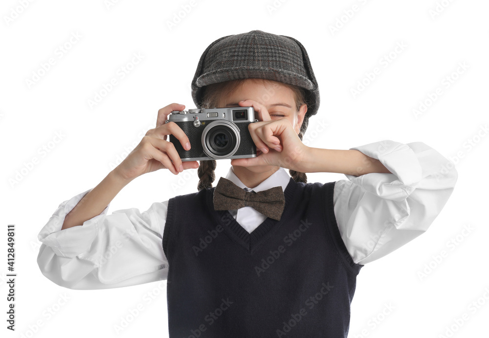 Cute little detective taking photo with vintage camera on white background